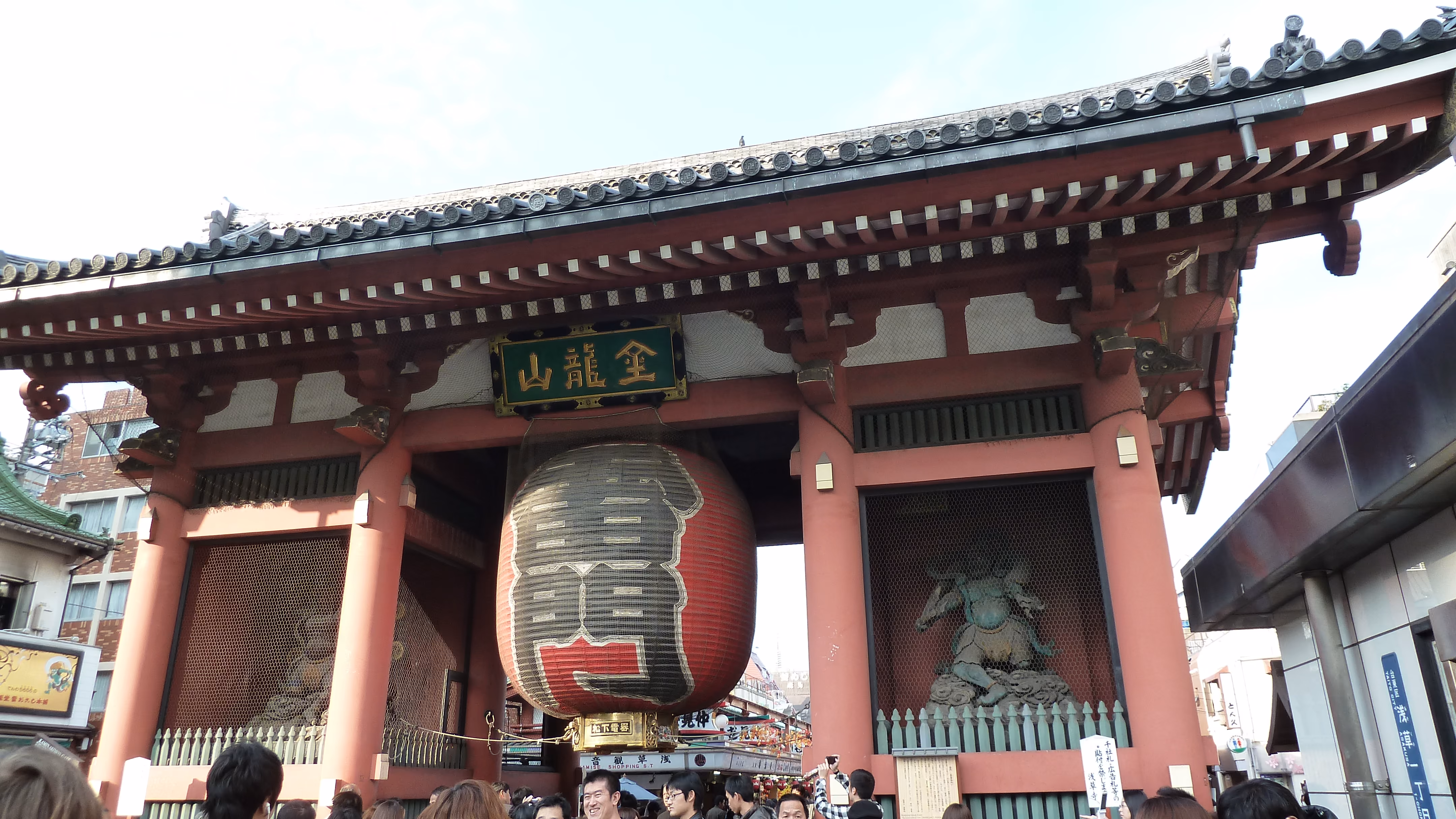Hōzōmon, the second gate at Senso-ji, with a large lantern and guardian statues in mesh-covered niches