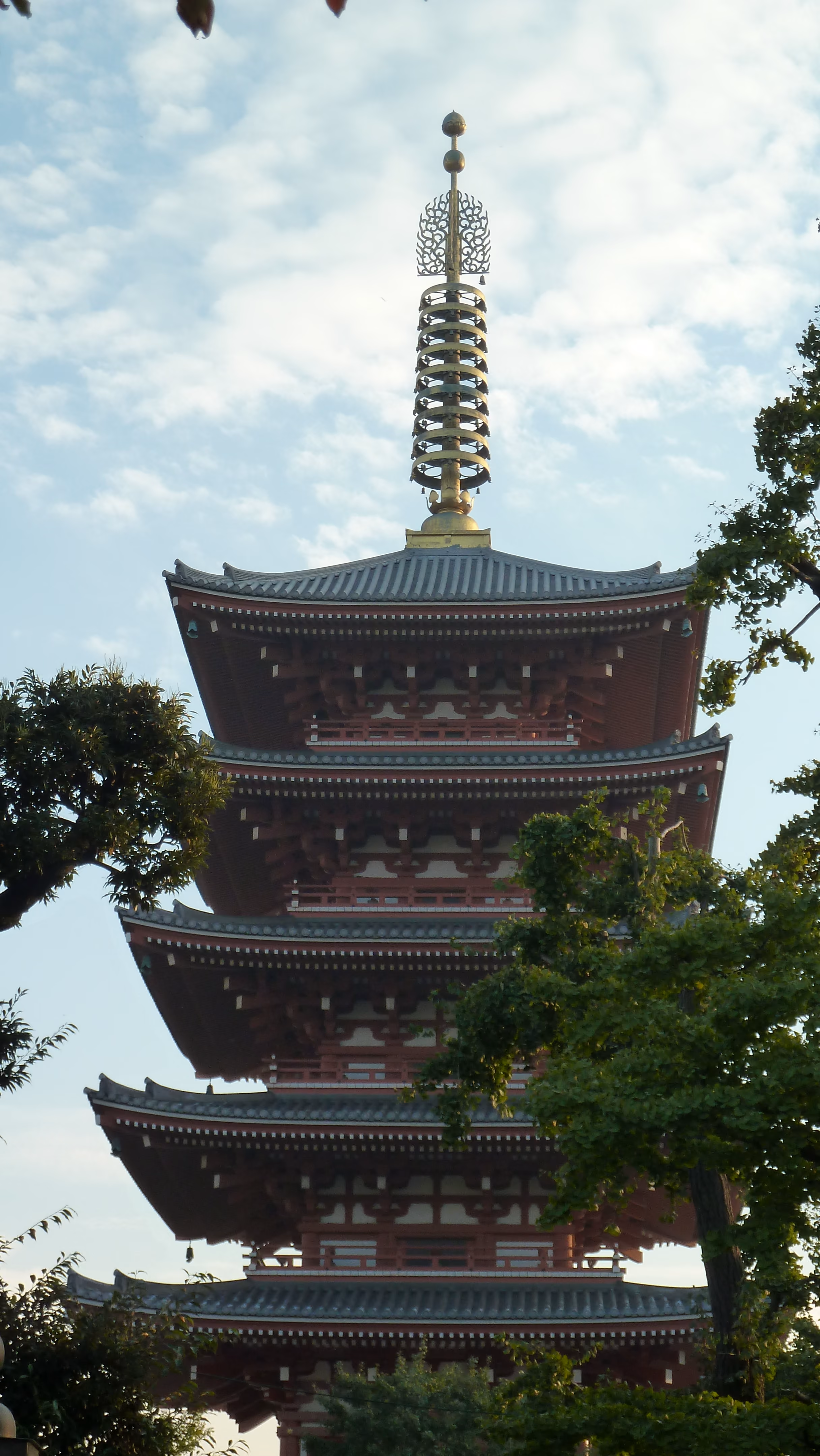 Senso-ji's five-story pagoda seen through tree branches