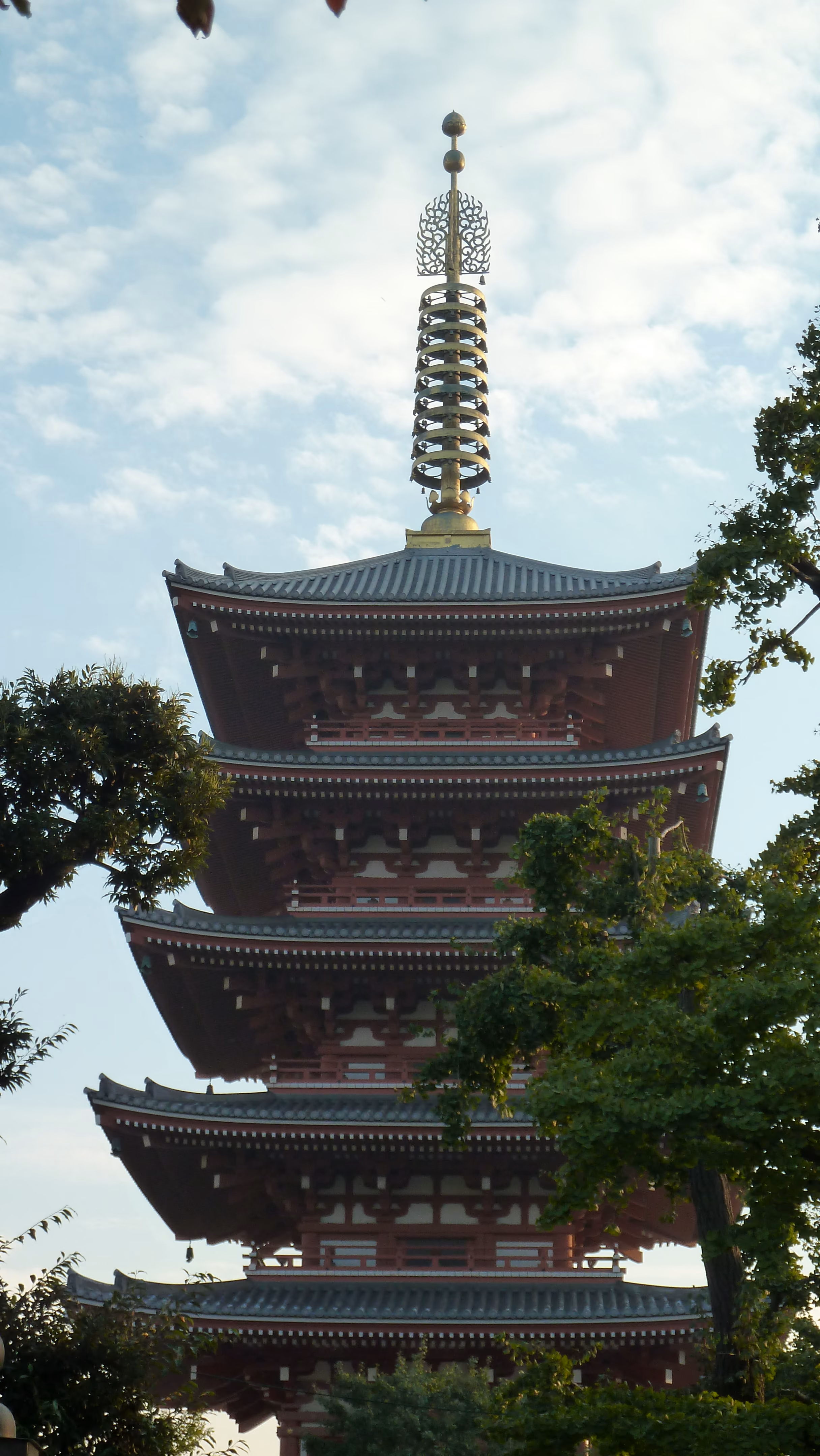 Senso-ji's five-story pagoda seen through tree branches