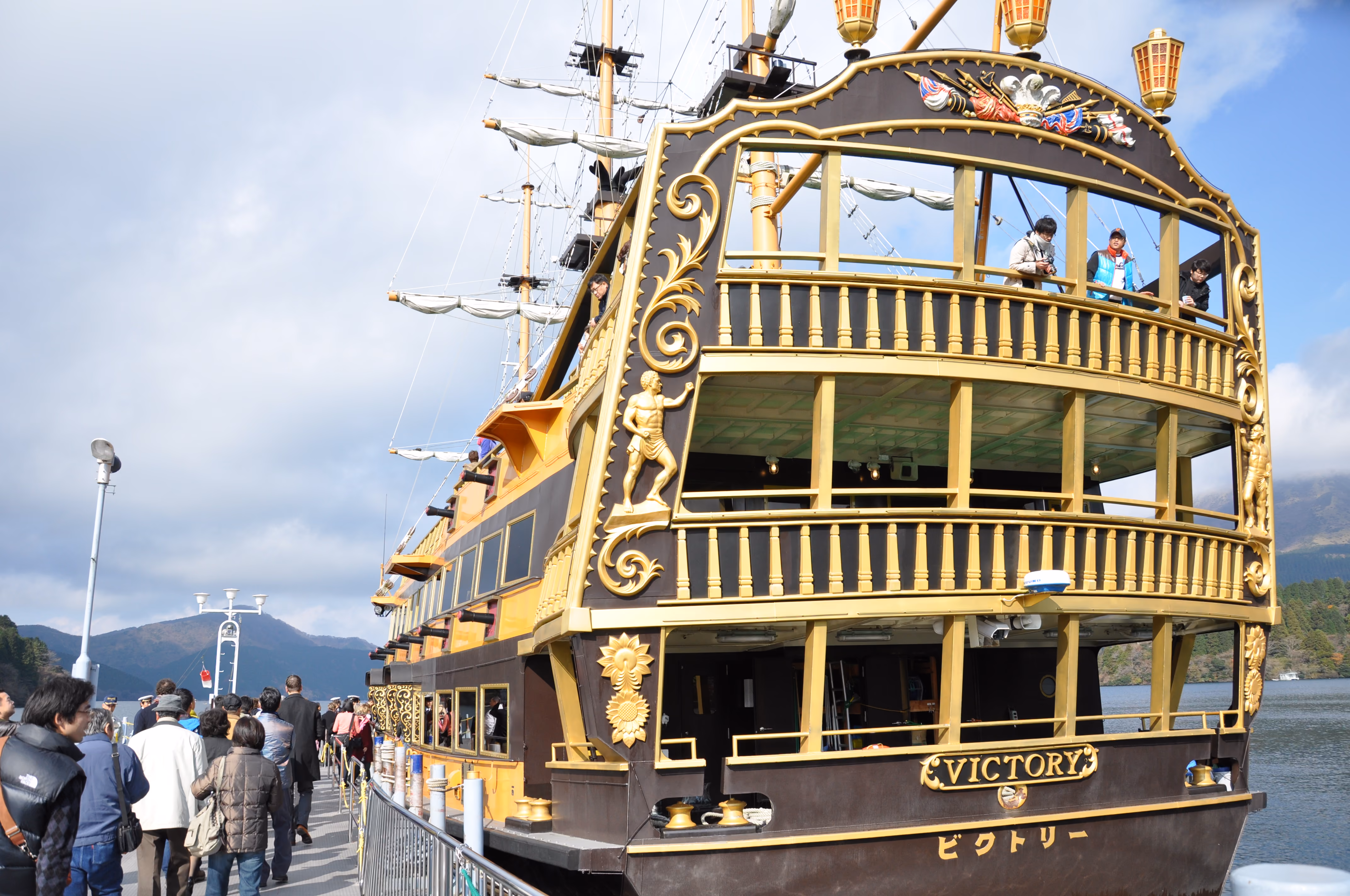 Ornate gilt detail on the stern of a pirate-ship-styled tour boat