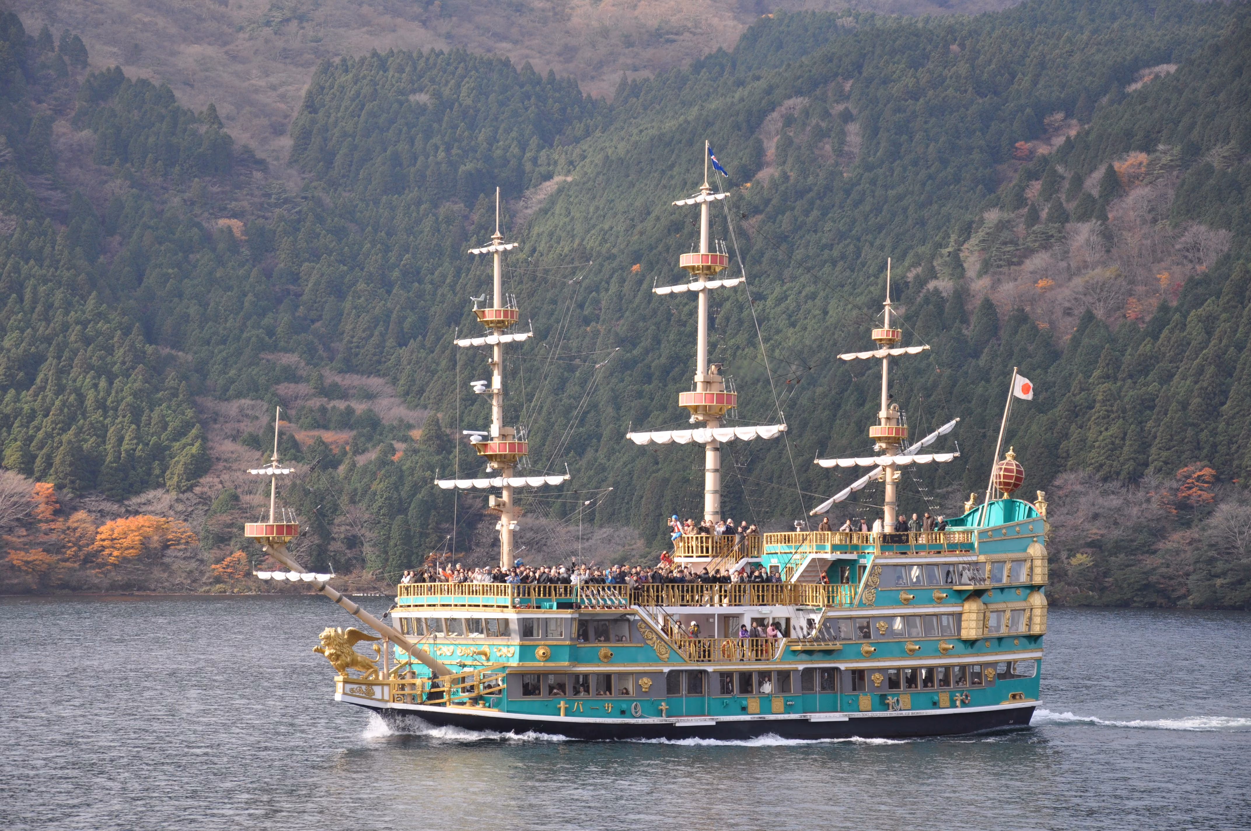 A pirate-ship-styled tourist boat crossing Lake Ashi, crowded with passengers